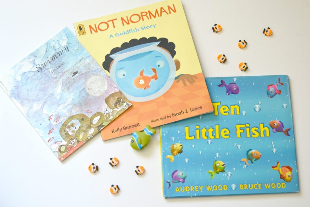 Photo of three fish picture books on a white background, Swimmy, Not Norman, and Ten Little Fish 