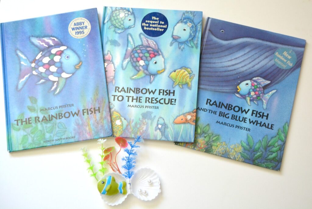 Photo of three Rainbow Fish books on a white background.